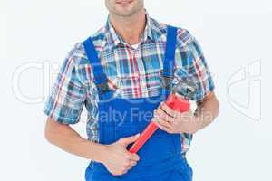 Cropped image of plumber holding monkey wrench