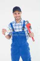 Plumber holding adjustable wrench and sink pipe