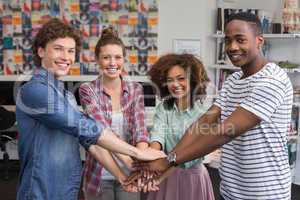 Fashion students high fiving together