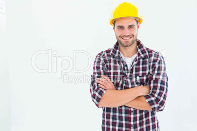 Handome male repairman standing arms crossed