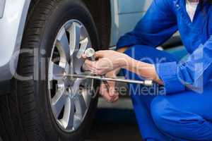 Mechanic adjusting the tire wheel