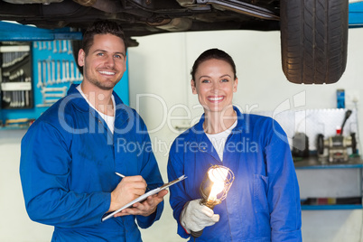 Team of mechanics smiling at camera