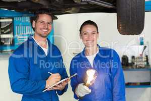 Team of mechanics smiling at camera