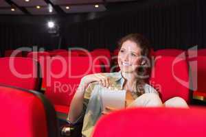 Young woman watching a film