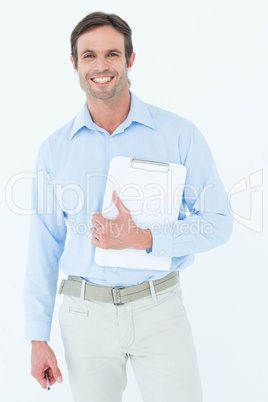 Confident supervisor holding clipboard