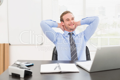 Relaxing businessman at his desk