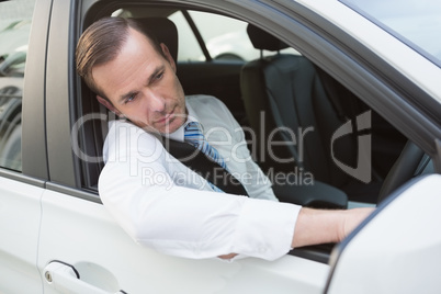 Handsome businessman smiling at camera