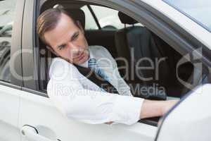 Handsome businessman smiling at camera