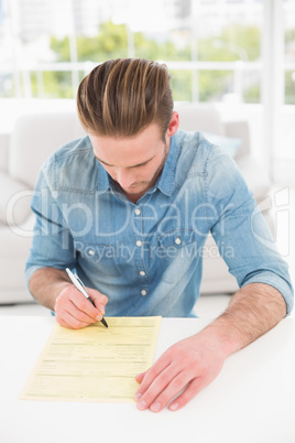 Young businessman signing a contract