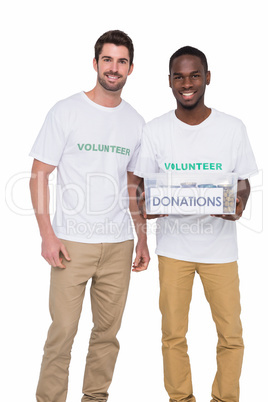Portrait of smiling men participating at charity