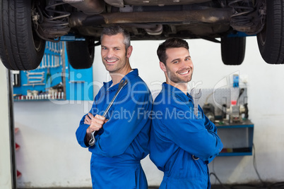 Team of mechanics smiling at camera