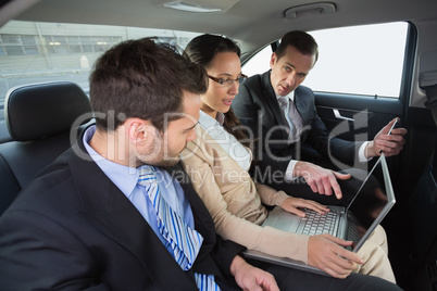 Business team working in the back seat