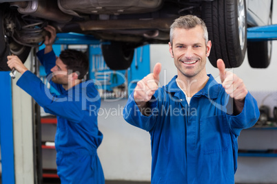 Team of mechanics working together Team of mechanics working together
