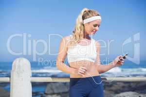 Fit blonde listening to music