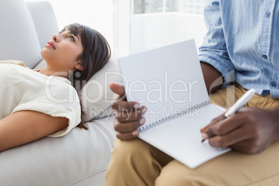 Therapist listening his patient and taking notes