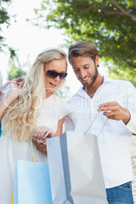 Cute couple looking at their shopping purchases