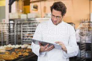 Baker reading something on clipboard