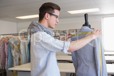 Fashion student working on mannequin