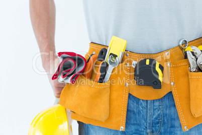 Technician with tool belt around waist