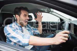 Young man experiencing road rage