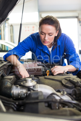 Mechanic working under the hood