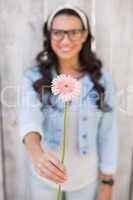 Pretty hipster holding a flower