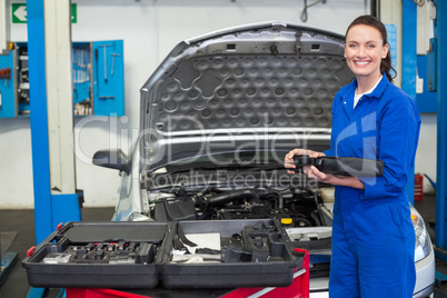 Mechanic smiling at the camera