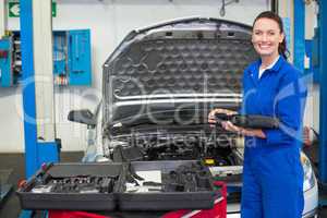 Mechanic smiling at the camera