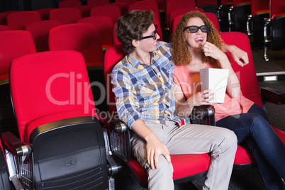 Young couple watching a 3d film