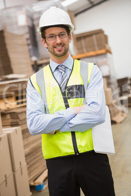 Worker wearing hard hat in warehouse