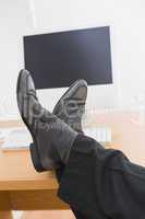 Relaxed businessman with his feet up