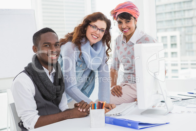 Teamwork posing and smiling at camera