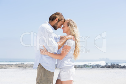 Cute couple hugging on the beach