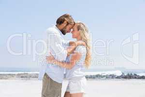 Cute couple hugging on the beach