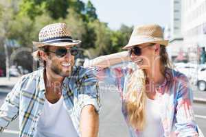 Attractive happy couple wearing sunglasses