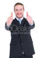 Positive businessman smiling with thumbs up