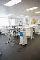 Empty class room with ironing board