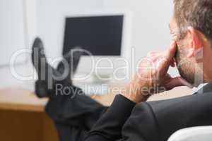 Relaxed businessman with his feet up