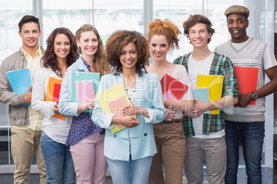 Fashion students smiling at camera together