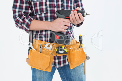 Handyman holding drill machine