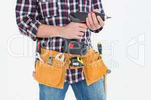 Handyman holding drill machine