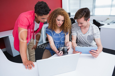 Students working with camera and tablet