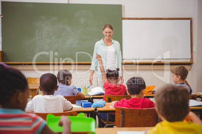 Pupil raising their hands during class