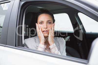 Nervous businesswoman looking at camera