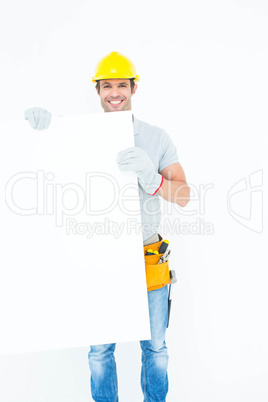 Handsome architect with bill board over white background