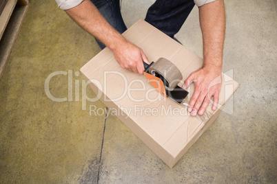 Close up of warehouse worker preparing a shipment