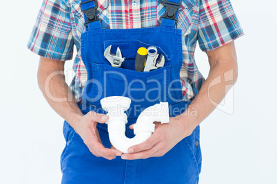 Cropped image of plumber holding sink pipe