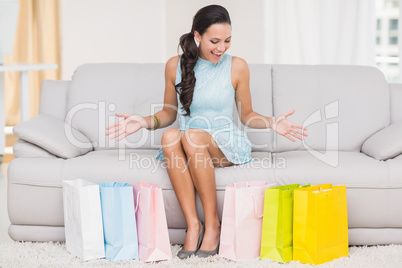 Stylish brunette with shopping bags