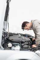 Stressed man looking at engine