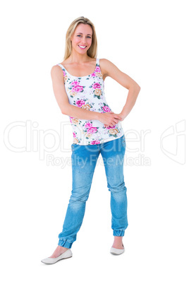 Smiling blonde posing with hand on hip